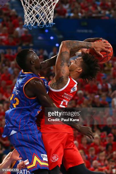Jean-Pierre Tokoto of the Wildcats goes to the basket against Majok Deng of the 36ers during the round 17 NBL match between the Perth Wildcats and...