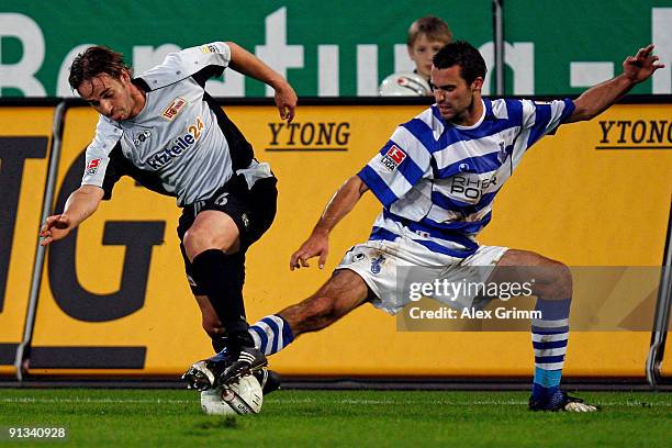 Bernd Rauw of Berlin is challenged by Kristoffer Andersen of Duisburg during the Second Bundesliga match between MSV Duisburg and 1.FC Union Berlin...