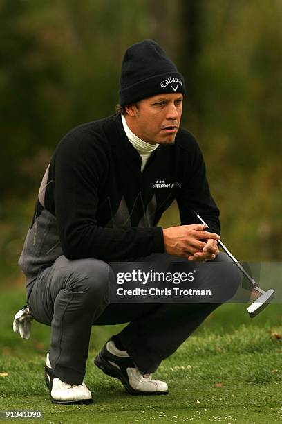 Fredrik Jacobson of Sweden lines up a putt on the 16th hole during the second round of the 2009 Turning Stone Resort Championship at Atunyote Golf...