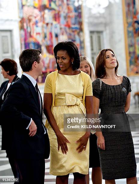 Danish Crown Prince Frederik , US First Lady Michelle Obama and Danish Crown Princess Mary look at tapestries at the Christiansborg Palace in...