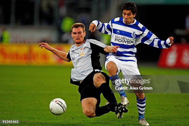 Olcay Sahan of Duisburg is challenged by Christian Stuff of Berlin during the Second Bundesliga match between MSV Duisburg and 1.FC Union Berlin at...
