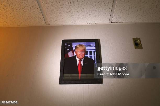 Portrait of President Donald Trump hangs on the wall during a naturalization ceremony on February 2, 2018 in New York City. U.S. Citizenship and...