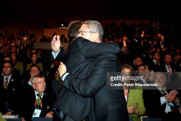 Spain's Prime Minister Jose Luis Zapatero is consoled by Madrid Mayor Alberto Ruiz Gallardon after Rio De Janeiro won the vote to stage the 2016...