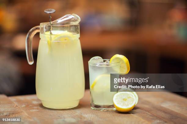 glass jar and glass with fresh lemonade - traditional lemonade stock pictures, royalty-free photos & images