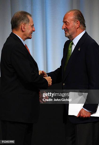 Spanish King Juan Carlos is greeted by IOC President Jacques Rogge after the Madrid 2016 presentation on October 2, 2009 at the Bella Centre in...