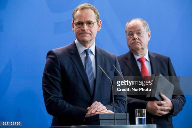 Berlin's Mayor Michael Mueller and former Finance Minister Peer Steinbrueck are pictured during the presentation of new 2 Euro coins with images of...