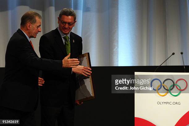 Madrid Mayor Alberto Ruiz Gallardon and IOC President Jacques Rogge after the Madrid 2016 presentation on October 2, 2009 at the Bella Centre in...