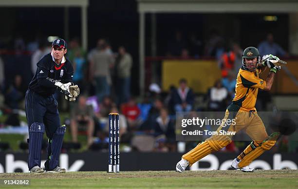 Ricky Ponting of Australia hits out as Steve Davies of England looks on during the ICC Champions Trophy 1st Semi Final match between Australia and...