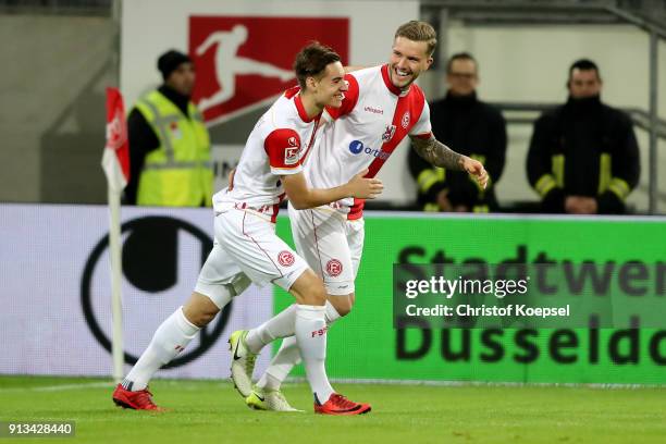 Andre Hoffmann of Duesseldorf celebrates the first goal with Florian Neuhaus of Duesseldorf during the Second Bundesliga match between Fortuna...