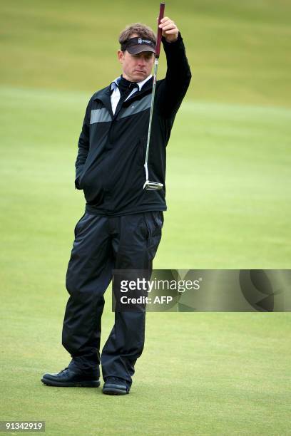 Actor Greg Kinnear lines up his putt on the St Andrews Old Course, in St Andrews, in Scotland, on the second day of the Alfred Dunhill Links...
