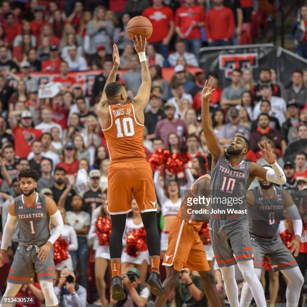 Eric Davis Jr. #10 of the Texas Longhorns shoots a jump shot over Niem Stevenson of the Texas Tech Red Raiders during the game on January 31, 2018 at...