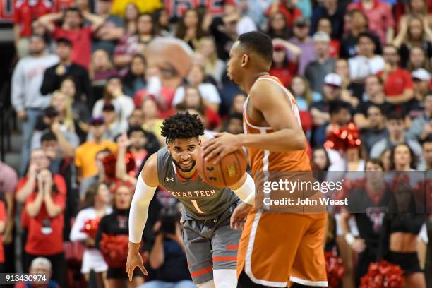 Brandone Francis of the Texas Tech Red Raiders guards Eric Davis Jr. #10 of the Texas Longhorns during the game on January 31, 2018 at United...