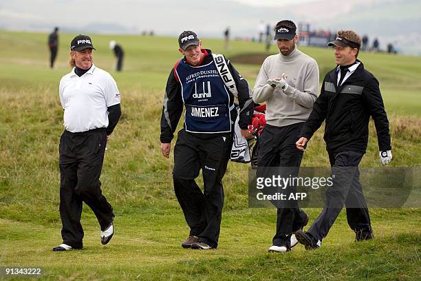 Actor Greg Kinnear and Spanish golfer Miguel Angel Jimenez walk on the St Andrews Old Course, in St Andrews, in Scotland, on the second day of the...