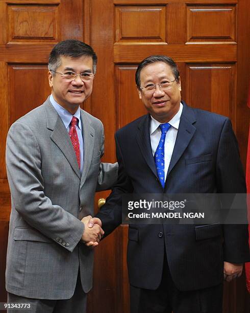 Commerce Secretary Gary Locke poses for a photo with Vietnam�s Deputy Prime Minister Pham Gia Khiem ahead of a meeting October 2, 2009 at the...
