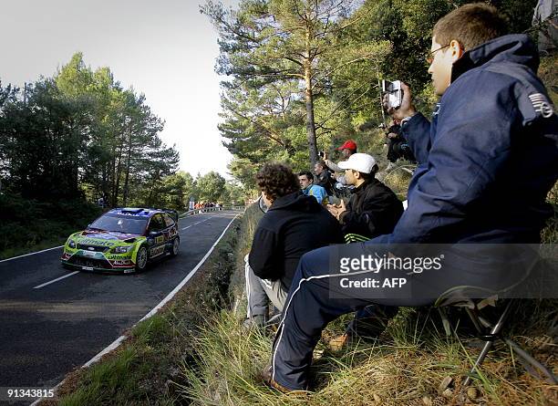 Finland's Jari-Matti Latvala and his co-diver Miikka Anttila drive their Ford Focus during the first stage of the 45th Rally of Catalonia in...