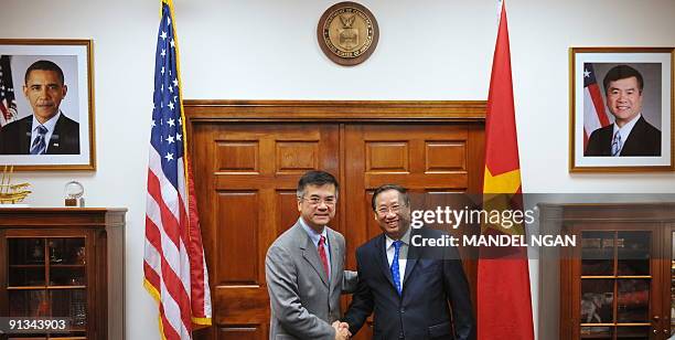 Commerce Secretary Gary Locke poses for a photo with Vietnam�s Deputy Prime Minister Pham Gia Khiem ahead of a meeting October 2, 2009 at the...