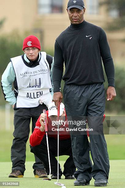 Marcus Allen lines up his putt with his playing partner Oliver Wilson on the 17th green during the second round of The Alfred Dunhill Links...