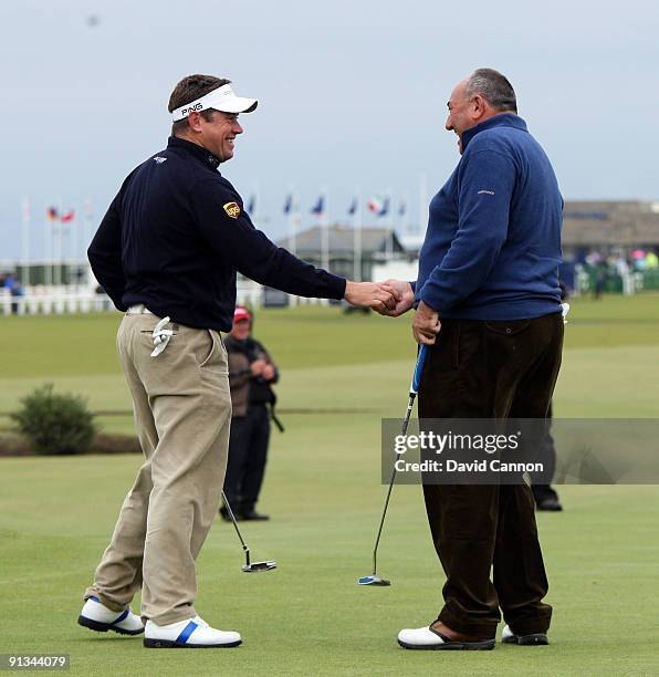 Lee Westwood and Andrew 'Chubby' Chandler on the 17th green during the second round of The Alfred Dunhill Links Championship at The Old Course on...