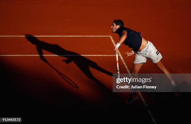 Cameron Norrie of Great Britain serves to Roberto Bautista Agut of Spain during day one of the Davis Cup World Group first round match between Spain...