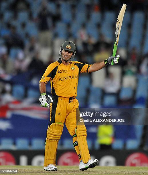 Australia's batsman Ricky Ponting raises his bat after his century during The ICC Champions Trophy 1st semi final between England and Australia at...