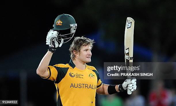 Australia's Shane Watson raises his bat after his century during the ICC Champions Trophy's first semi final match between Australia and England at...