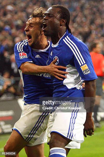 Gerald Asamoah of Schalke celebrates the first goal with Rafinha during the Bundesliga match between FC Schalke 04 and Eintracht Frankfurt at Veltins...