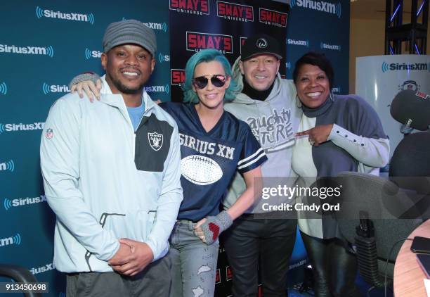 SiriusXM radio host Sway Calloway, Jenny McCarthy, Donnie Wahlberg and SiriusXM radio host Heather B attend SiriusXM at Super Bowl LII Radio Row at...