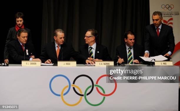 International Olympic Committee President Jacques Rogge, Rio de Janeiro 2016 President Carlos Nuzman and Rio Mayor Eduardo Paes rejoice after signing...