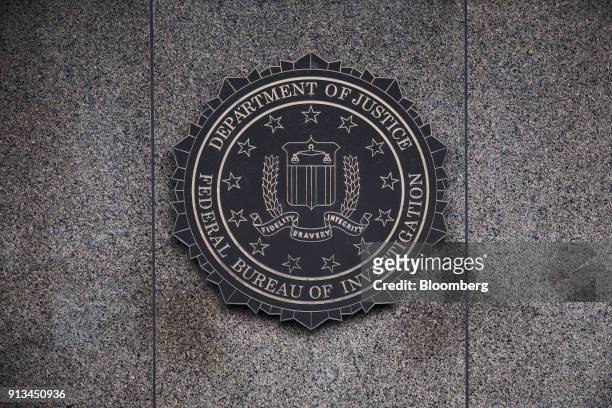 The Federal Bureau of Investigation seal is displayed outside FBI headquarters in Washington, D.C., U.S., on Friday, Feb. 2, 2018. FBI and Justice...
