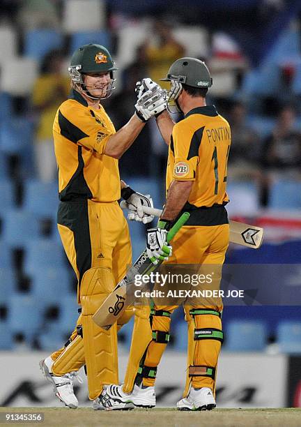 Australia's batsman Shane Watson and Ricky Ponting congratulate each other during The ICC Champions Trophy 1st semi final between England and...