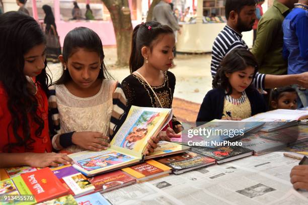 Bangladeshi shoppers brows books at a stall during the country's largest book fair in Dhaka on February 02, 2018. Bangladesh's largest book fair...