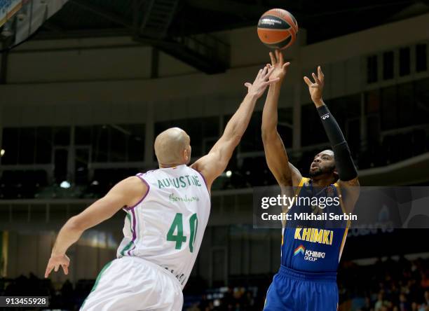 James Anderson, #21 of Khimki Moscow Region competes with James Augustine, #40 of Unicaja Malaga in action during the 2017/2018 Turkish Airlines...