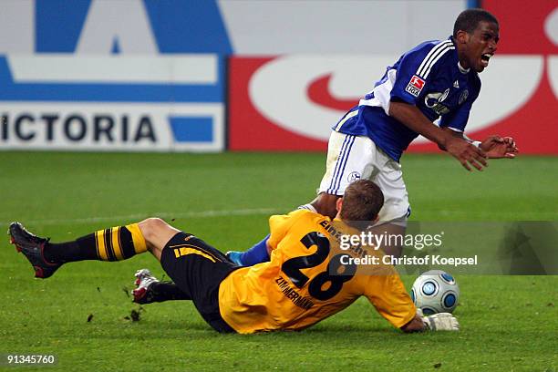 Jan Zimmermann of Frankfurt fouls Jefferson Farfan of Schalke in the penalty area during the Bundesliga match between FC Schalke 04 and Eintracht...