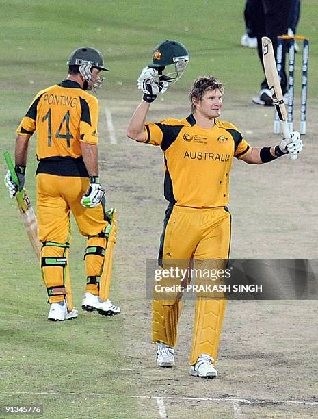 Australia's Shane Watson celebrates his century as capatain Ricky Ponting looks on during the ICC Champions Trophy's first semi final match between...