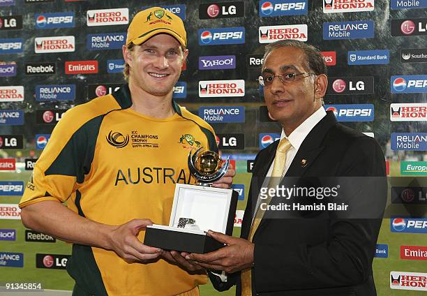 Shane Watson of Australia poses with his man of the match award presented to him by ICC CEO Haroon Lorgat after the ICC Champions Trophy 1st Semi...