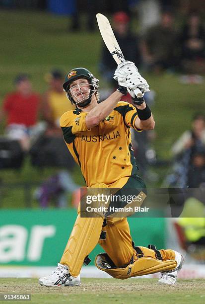 Shane Watson of Australia hits a six from the bowling of Paul Collingwood during the ICC Champions Trophy 1st Semi Final match between Australia and...