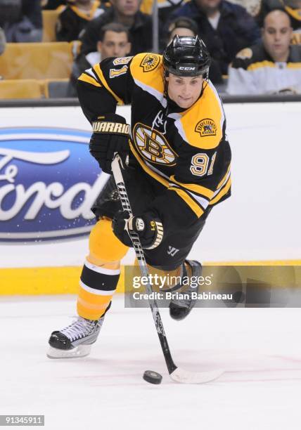 Marc Savard of the Boston Bruins skates with the puck against the Washington Capitals at the TD Banknorth Garden on October 1, 2009 in Boston,...