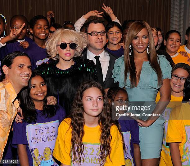 Musician Lady Gaga, Billboard Magazine Editor and Cheif Bill Werde and singer Beyonce pose the childrens chorous from P.S. 22 at Billboard's 4th...