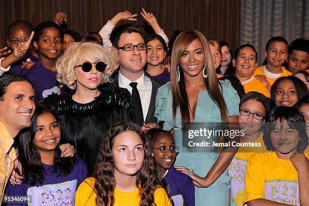 Musician Lady Gaga, Billboard Magazine Editor and Cheif Bill Werde and singer Beyonce pose the childrens chorous from P.S. 22 at Billboard's 4th...