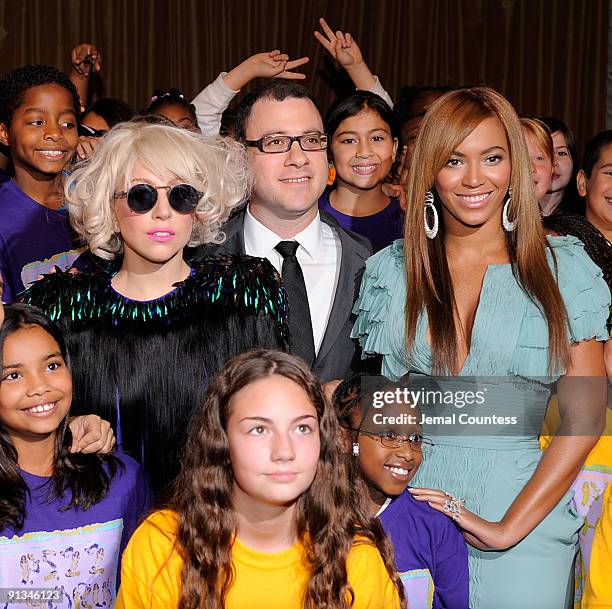 Musician Lady Gaga, Billboard Magazine Editor and Cheif Bill Werde and singer Beyonce pose the childrens chorous from P.S. 22 at Billboard's 4th...