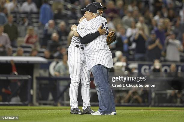 New York Yankees Mariano Rivera hugging Panama President Ricardo Martinelli after ceremonial first pitch before game vs Boston Red Sox. Bronx, NY...