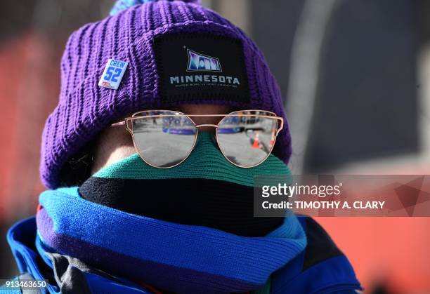 Fan stands in cold weather during the Super Bowl LIVE, a 10-day fan festival leading up to Super Bowl LII, taking place on Minneapolis Nicollet Mall...