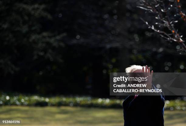 President Donald Trump walks to Marine One on the South Lawn before departing the White House in Washington, DC on February 2, 2018.