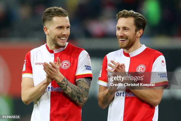 Andre Hoffmann ands Adam Bodzek of Duesseldorf celebrate after the Second Bundesliga match between Fortuna Duesseldorf and SV Sandhausen at...