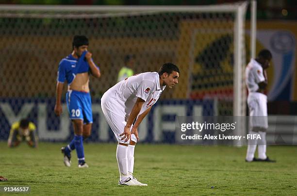 Matthew James of England and Uzbekistan players look dejected at the close of the FIFA U20 World Cup Group D match between Uzbekistan and England at...