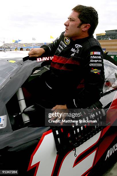 David Stremme, driver of the Verizon Wireless Dodge, gets out of his car after qualifying for the NASCAR Sprint Cup Series Price Chopper 400...