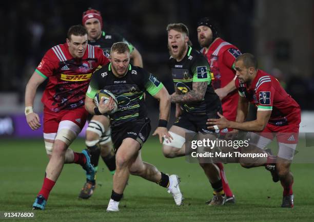 Mikey Haywood of Northampton Saints breaks through the Harlequins defence during the Anglo-Welsh Cup match between Northampton Saints and Harlequins...