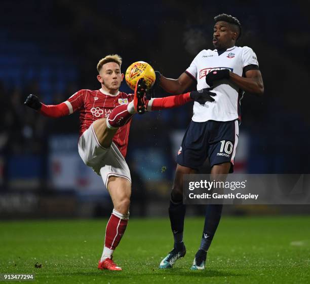 Josh Brownhill of Bristol City battles for the ball with Sammy Ameobi of Bolton Wanderers during the Sky Bet Championship match between Bolton...