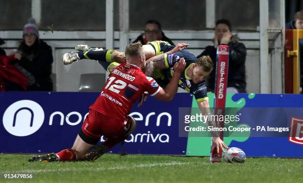 Wakefiekd Trinity's Tom Johnstone dives in to score his sides first try of the game during the Betfred Super League match at Craven Park, Hull.