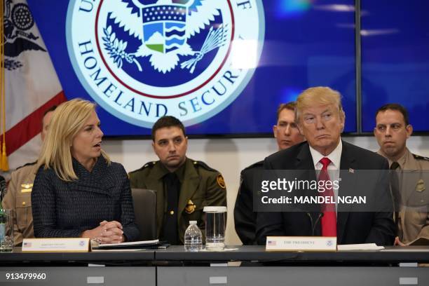 President Donald Trump listens as US Homeland Security Secretary Kirstjen Nielsen speaks during a meeting at the Customs and Border Protection...